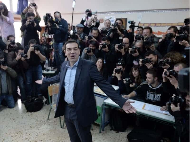 The leader of Greece's left-wing Syriza party Alexis Tsipras poses prior to cast his ballot at a polling station in Athens on January, 2015. Greece votes today in a crucial general election that could bring the anti-austerity Syriza party to power and lead to a re-negotiation of the country's international bailout. AFP PHOTO LOUISA GOULIAMAKI (Photo credit should read LOUISA GOULIAMAKI/AFP/Getty Images)