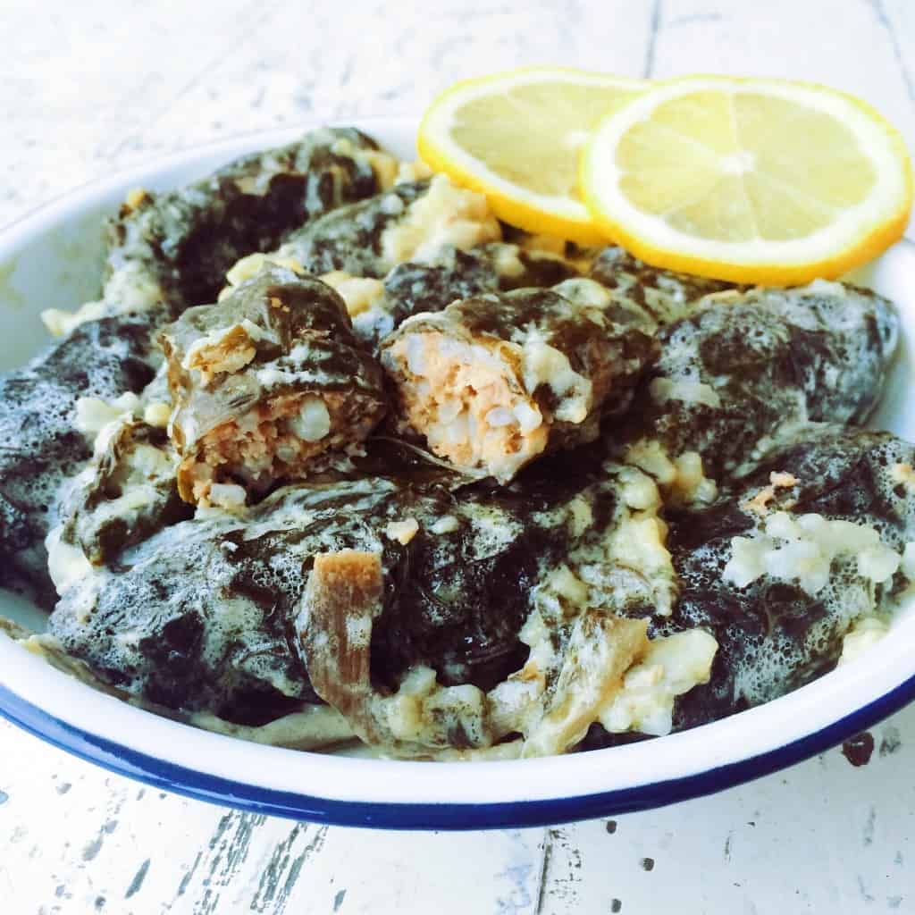 Spinach Dolmades drizzled in Avgolemono
