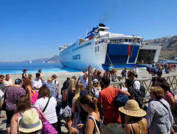 People entering greek ferry