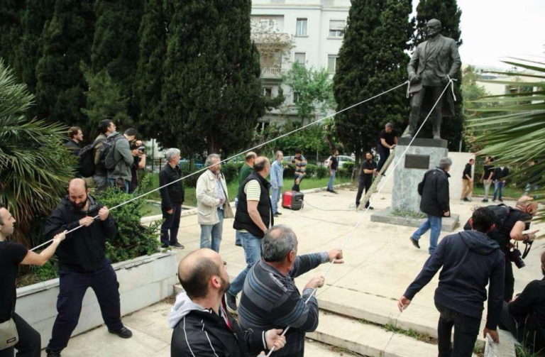 Anti-war protestors try to demolish US statue in Athens