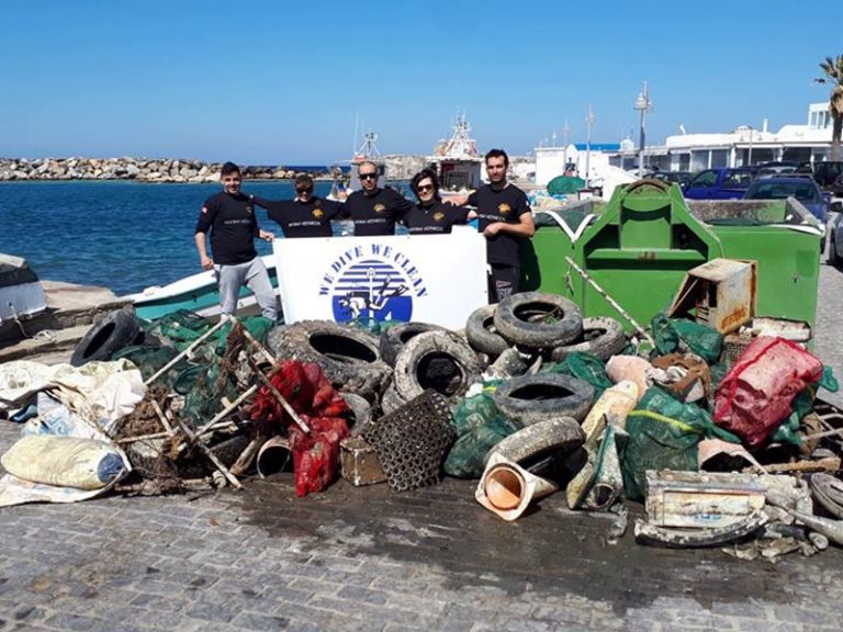Greek volunteer divers remove 1,500 kilos of rubbish from the harbor of Naousa, Paros