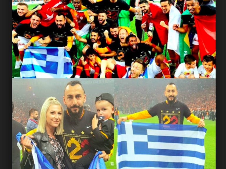 Greek striker Kostas Mitroglou celebrates championship win by holding up Greek flag in Turkish stadium  