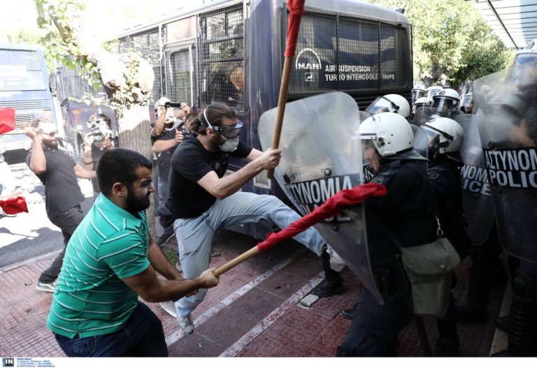 Greek police and students clash during business reform protests in Athens