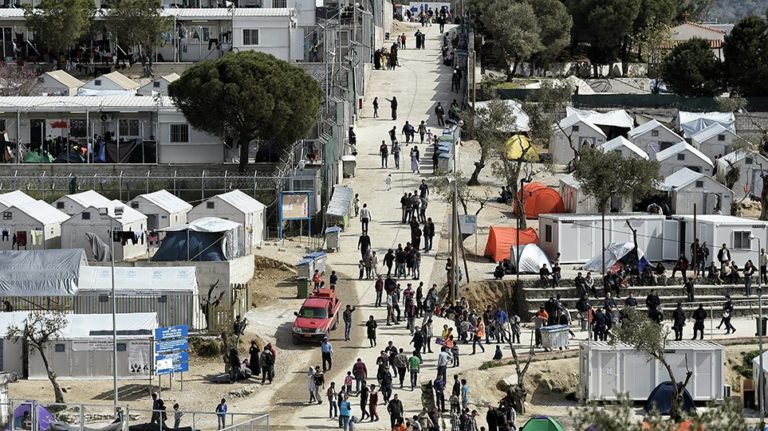 Greece to shut overcrowded migrant camps and replace with restricted facilities  