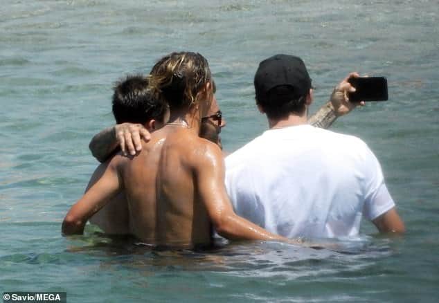 David Beckham hits the beach with his sons in Greece