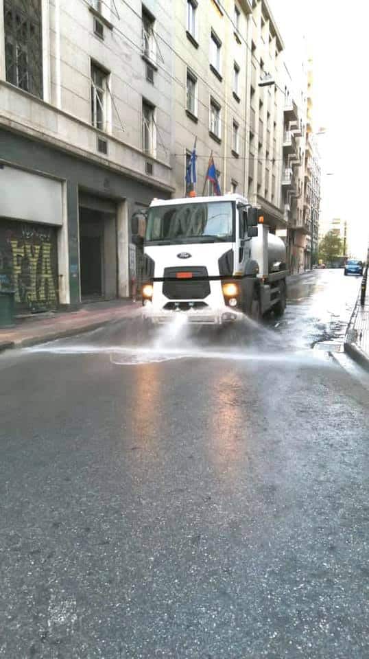 Street cleaning operation in Omonoia, Athens