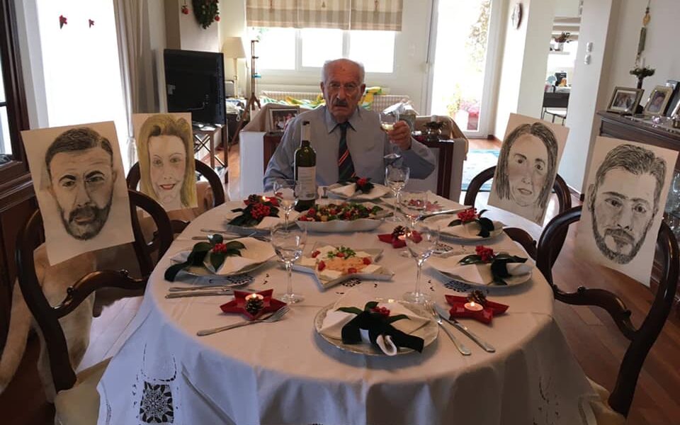 Greek parents fill empty seats at the Christmas table with portraits of their children