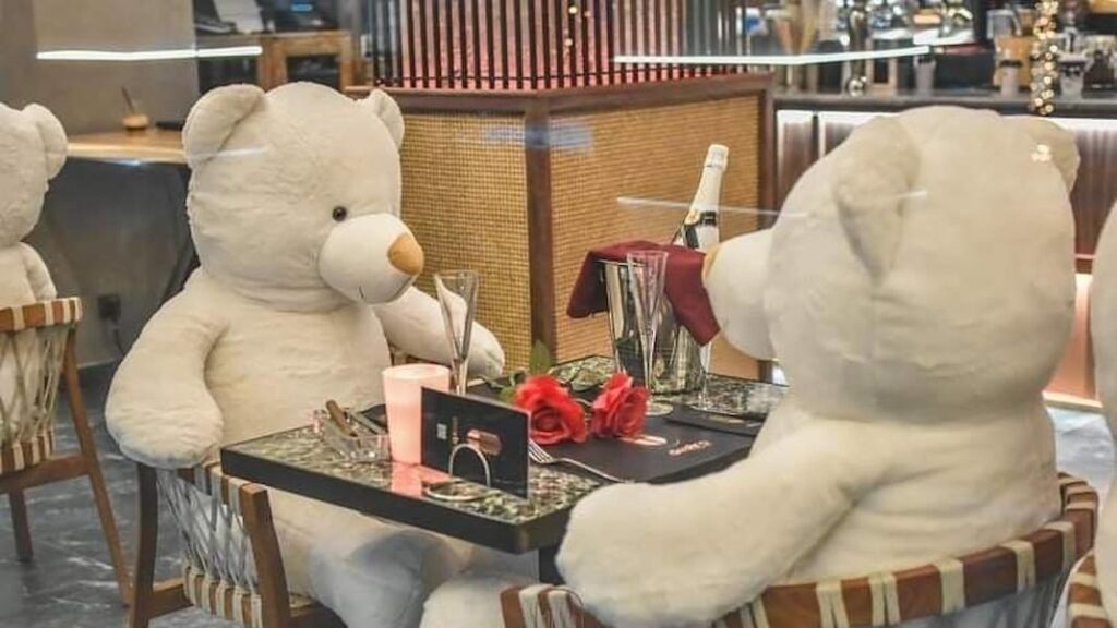 Teddy bears replace diners at a cafe in Karditsa