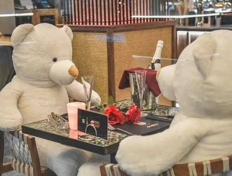Teddy bears replace diners at a cafe in Karditsa