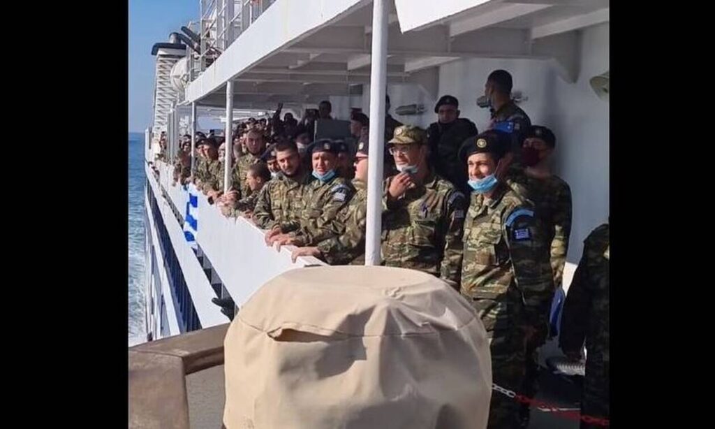 Footage of soldiers singing the Greek National Anthem as they approach Kastellorizo