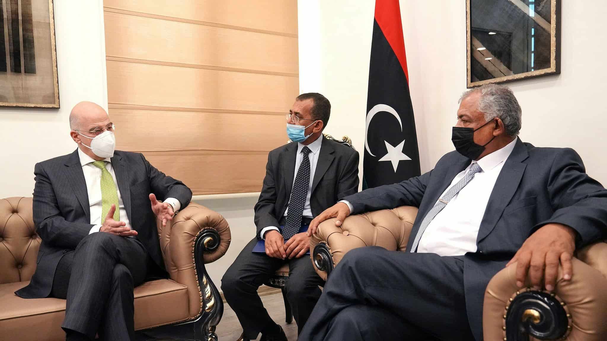 Nikos Dendias with Libyan Deputy Prime Minister Hussein Atiya Abdul Hafeez Al Qatrani in Benghazi on April 12, 2021.