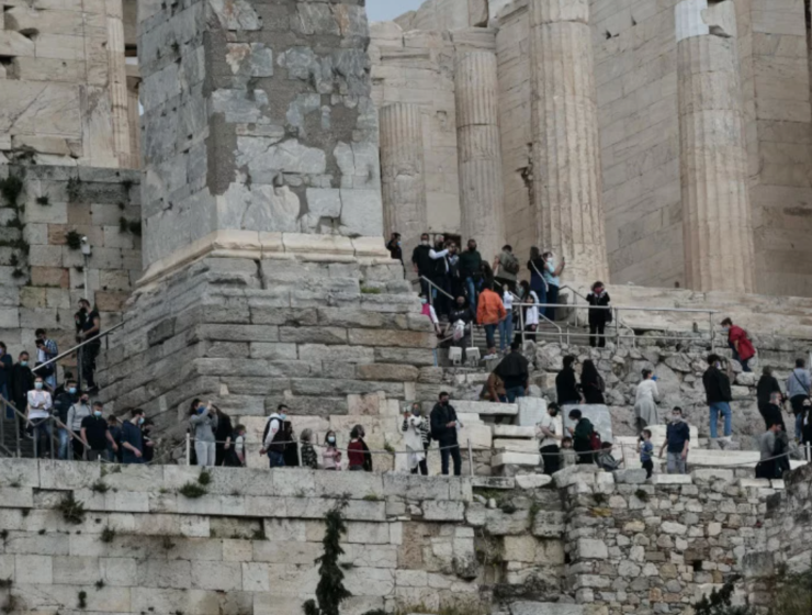 Visitors wait in long queues to visit the Acropolis on World Heritage Day