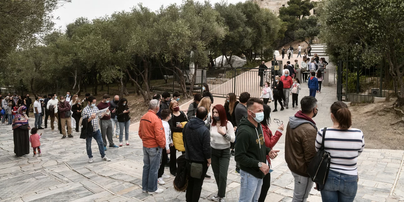Visitors wait in long queues to visit the Acropolis on World Heritage Day