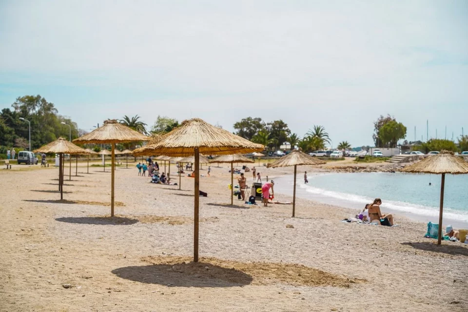 New umbrellas and fresh sand at Glyfada Beach