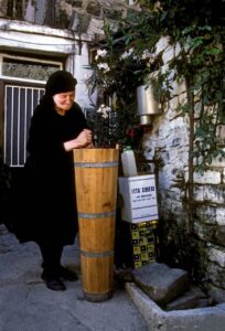 Greek woman making feta cheese in the village of Tsepelevo