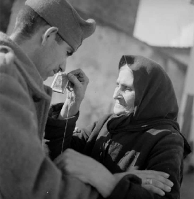 A Greek Mother blesses her soldier son and gives him an icon of Saint George as he sets off to defend Greece 3