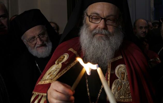 (Photo: Reuters / Khaled al-Hariri)Newly elected Orthodox Patriarch Youhanna (John) Yaziji, lights a candle on his arrival to the Orthodox Patriarchate in Damascus Dec. 20, 2012, next to Patriarch Gregory III Laham, spiritual leader of the Melkite Greek Catholic Church.