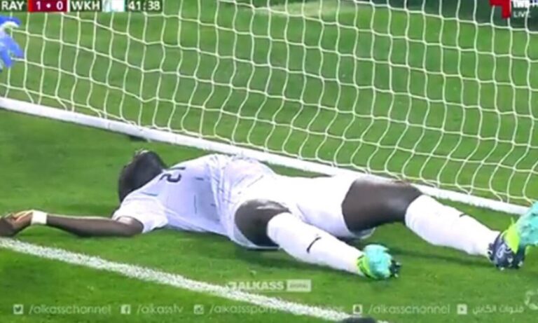 Ex Panathinaikos player Othman Coulibaly collapses on the field at the Al-Gharafa Stadium in Qatar