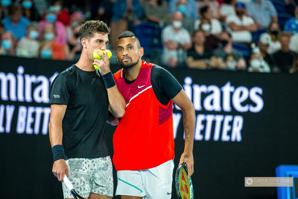 Thanasi Kokkinakis' rumoured girlfriend Paige Henry cheers him on as the Special Ks (with Nick Kyrgios) crash out of Australian Open 2026 doubles amid shoulder injury woes.
