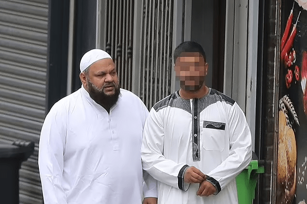 Rotherham grooming gang member Qurban Ali (left) has been pictured taking a stroll in Sheffield after his release from jail, just miles from where his crimes took place