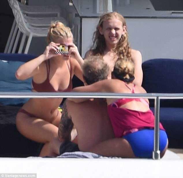 The rocker, 54, looked in his element as he relaxed on board the luxurious vessel with his wife Francesca and their two daughters Cali, 20, and Marcella, 16, [L] and son Castor, 18 [R]