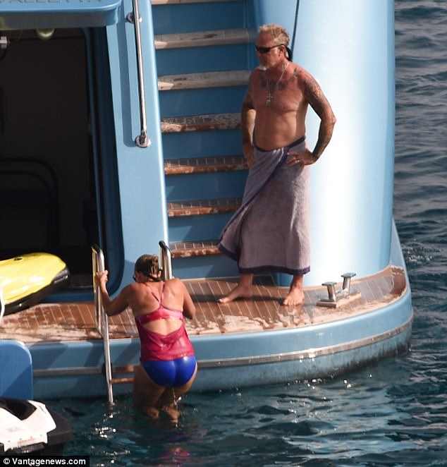 Fun in the sun: James and Francesca shared a giggle as she ascended the ladder after her ocean swim