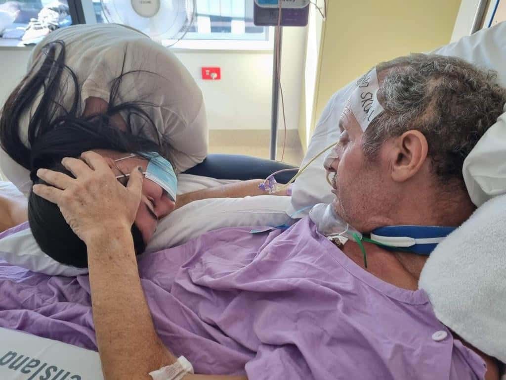 The father-of-five has a long recovery ahead with another operation to replace the skull piece that was removed to let the brain swell outside of the skull.