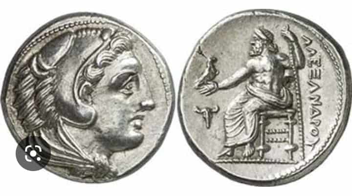 Ancient coin depicting the head of Alexander the Great with the inscription of his name, in Greek.