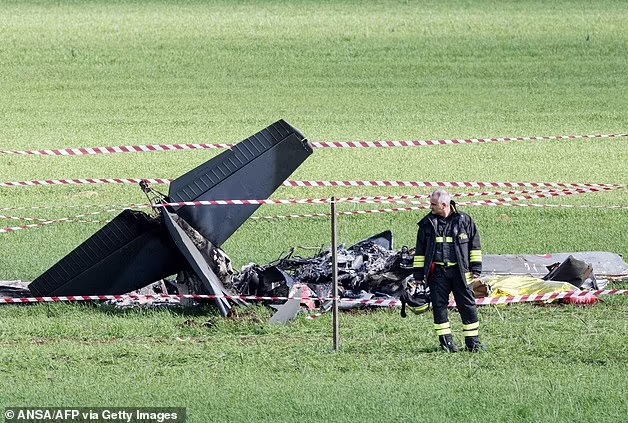 The two pilots were on board U-208 training aircraft and were participating in a training mission near Guidonia, according to an Air Force press release. Pictured: The second of the two wrecks is seen in the middle of a field near to the town