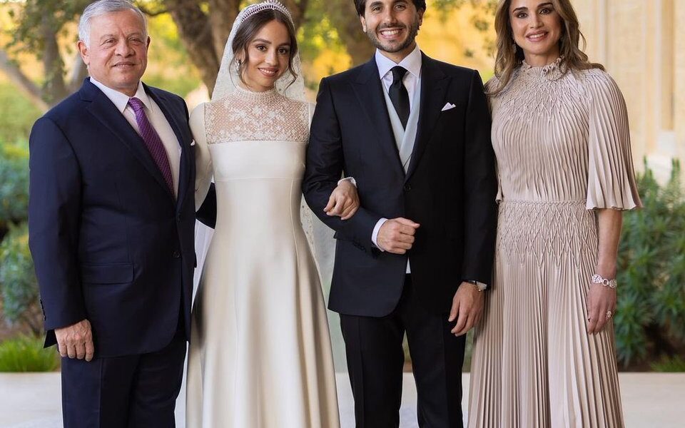 Princess Iman and Jameel Thermiotis alongside King Abdullah and Queen Rania in Their Official Wedding Portrait. Princess Iman in Dior Wedding Dress which featured a Full Skirt and a Sheer Lace Panel and Lace-Cuffed Sleeves. Chaumet Diamond Tiara owned by her Grandmother.