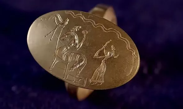 A piece of jewellery the team found; many showed scenes of battle or splendour (Image: Youtube/Smithsonian Channel)