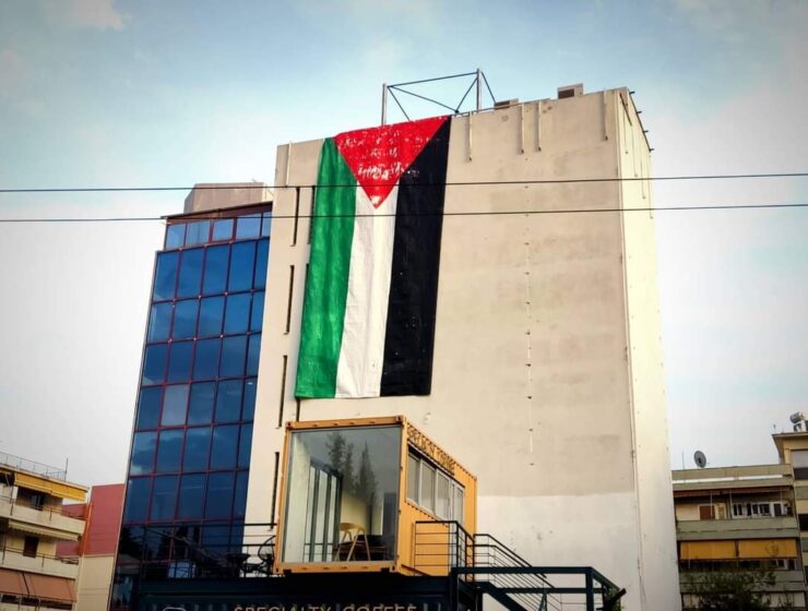 In Greece the anarchist group "Rouvikonas" put up a huge #Palestine flag in front of the embassy of #Israel