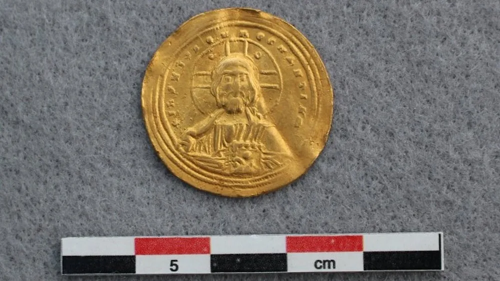 A gold coin depicting Jesus Christ. .