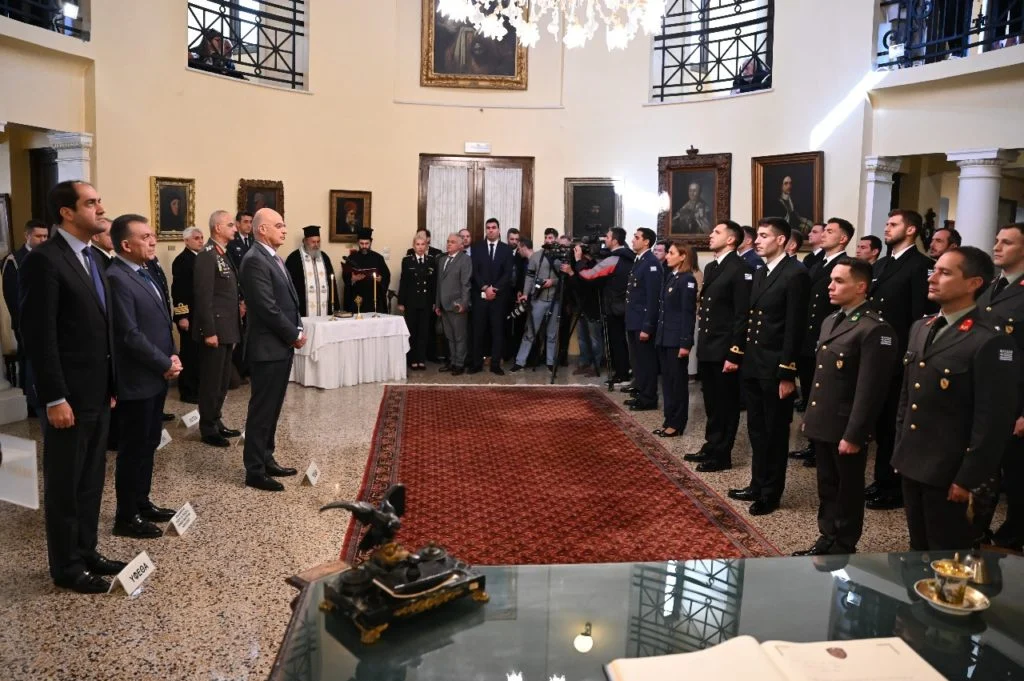 Stefanos Ntouskos, Eleftherios Petrounias and Miltos Tentoglou, along with other Greek Olympians, being sworn into the Greek military.