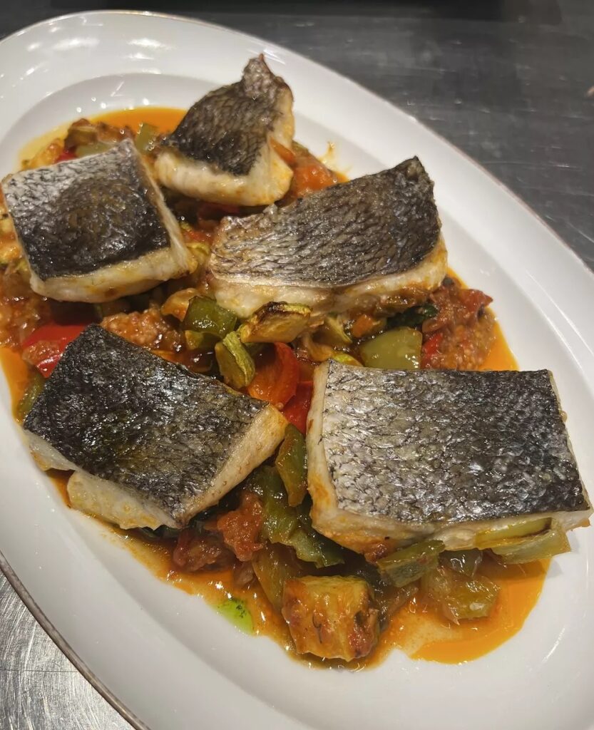 Fish with vegetables in the oven