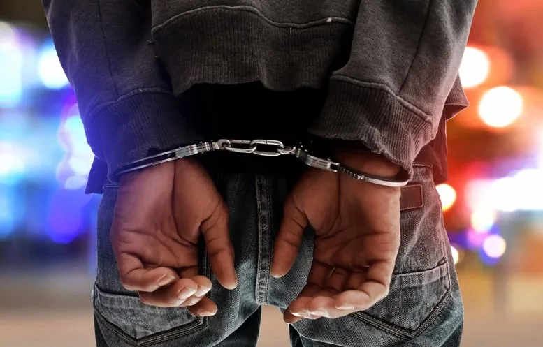 Pakistani arrested handcuffed handcuffs