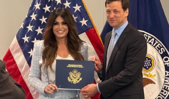 Kimberly Guilfoyle has graduated from Ambassador School and is set to be confirmed as the U.S. Ambassador to Greece. Her confirmation hearing is upcoming, with votes from the Senate Foreign Relations Committee and full Senate following.