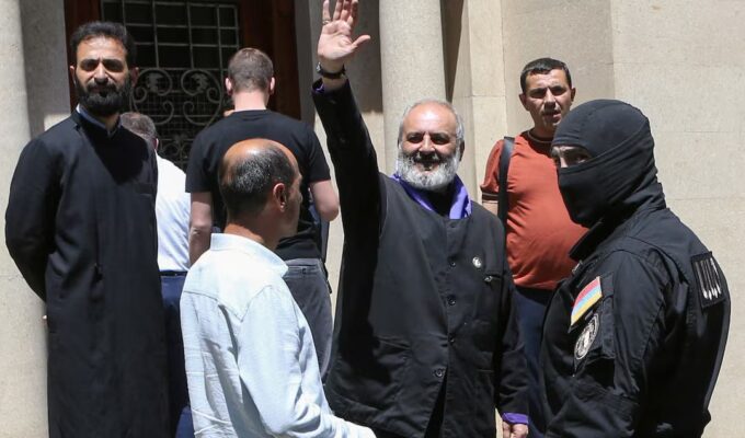 Archbishop Bagrat Galstanyan, a prominent Armenian Apostolic Church leader and head of the Sacred Struggle opposition, was arrested with 13 others for allegedly plotting to overthrow the government through terror attacks, including bombings and arson. His lawyer calls the charges fabricated, amid rising tensions between the church and PM Pashinyan ahead of next year’s elections.