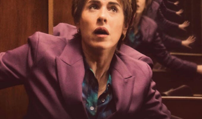 Film poster for MURPHY'S LAW. Image of a woman with short dark hair wearing a purple blazer looking stunned