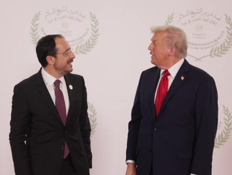 Ambassador of Greece and former US President Donald Trump engaging in diplomatic discussion at Greece-US summit for peace and international relations.