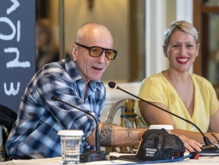 Thoughtful discussion at a Greek City Times event featuring diverse representatives of Greek culture and media, promoting dialogue and community engagement in Greece.